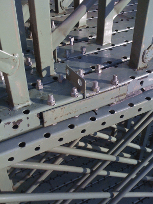 Pallet rack frames precariously bolted together