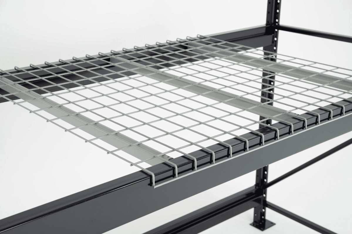 A wire deck with inverted u-channels on black pallet rack beams