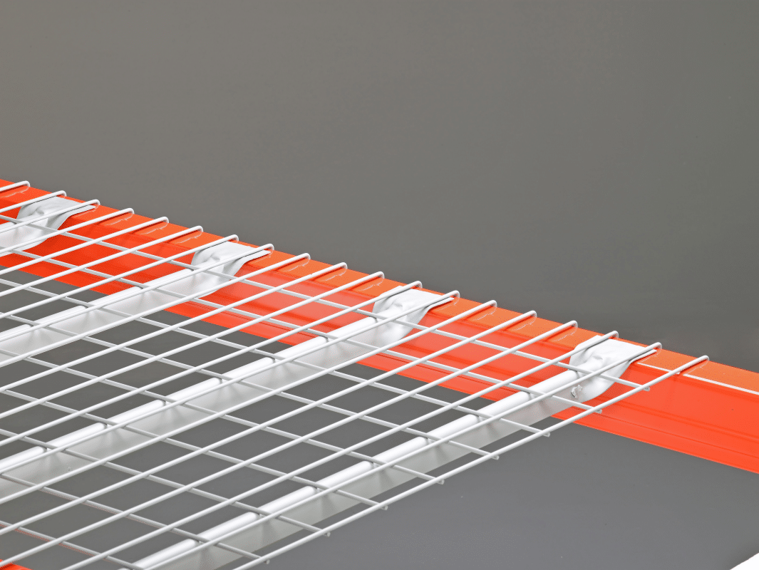 A wire deck with inverted flare-channels on orange pallet rack beams