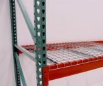 pallet rack wire decking sitting on two pallet rack beams